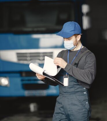 Man in a mask. Receipt of goods for coronavirus. Stop coronavirus